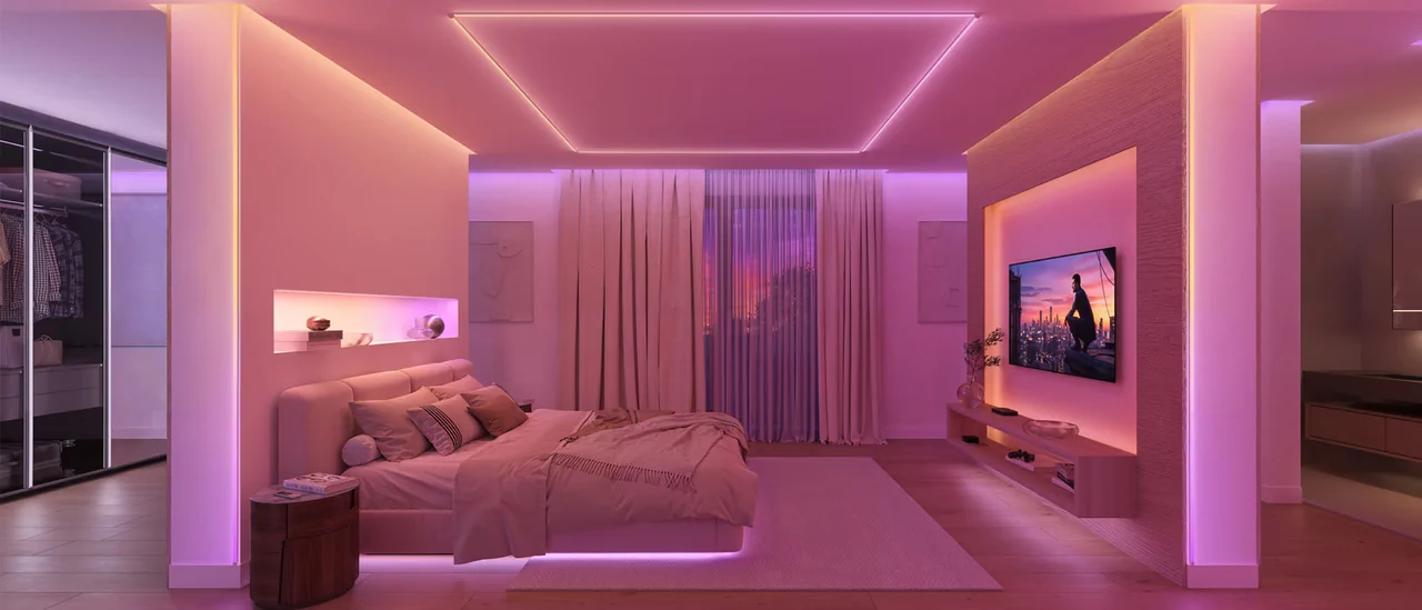 Philips Hue LED-strips met kleurverloop achter een tv-meubel